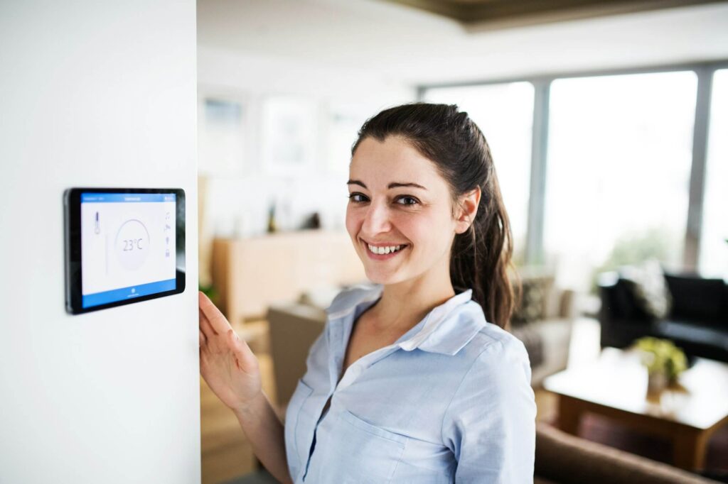 a-woman-looking-at-tablet-with-smart-home-screen-.jpg